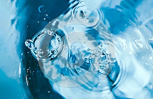 Water splash close-up. Drop of water. Blue water drop. Falling water