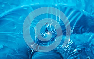 Water splash close-up. Drop of water. Blue water drop. Falling water