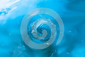 Water splash close-up. Drop of water. Blue water drop. Falling water