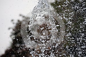 Water splash in fountain, abstract background. Water drops, city fountains in autumn