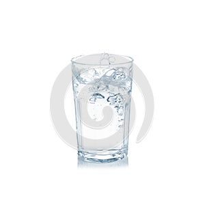 Water splash in glass isolated on white.