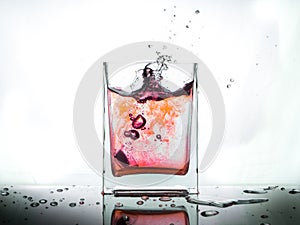 Water splash in glass isolated on white background...