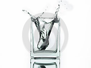 Water splash in glass isolated on white background