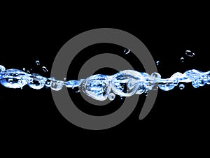 Water splash isolated on black.