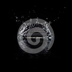 Water splash isolated on black background.