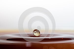 Water splash with one drop and waves