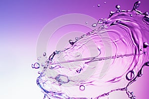 Water splash on a purple color