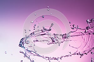 Water splash on a purple color