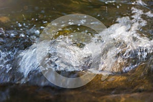 Water splash in river and sunlight on surface for nature background