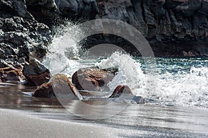 Water splash at the rocky coast of Tenerife island