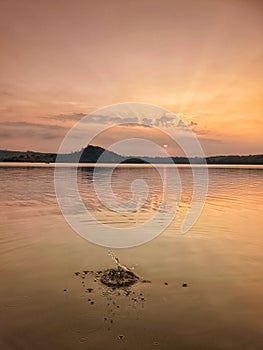 Water splash at Setu patok dam in sunset time