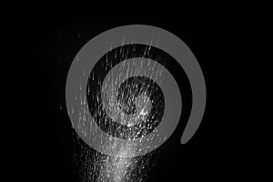 Water splash, spray jet and steam from steam generator isolated on black background. Perfect design element