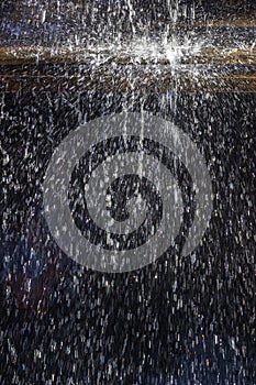 Water splashes against a dark background