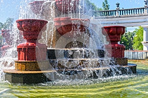 Water and splashes in the city fountain in summer