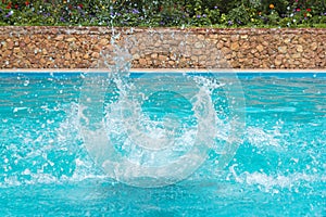 Water splashes in the swimming pool
