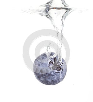 Water splashing blueberry