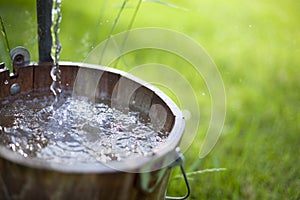 Water Splashing in Bucket photo