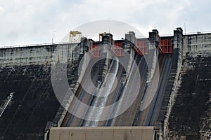 Water splashing from floodgate Khun Dan Prakarn Chon huge concrete dam in Thailand