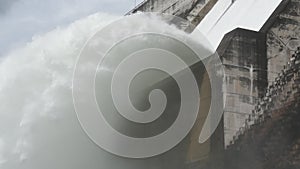 Water splashing from floodgate Khun Dan Prakarn Chon huge concrete dam in Thailand