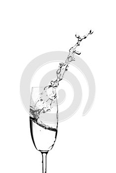 Water splashing out of a champagne glass