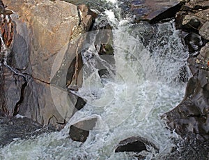 Water splashing over rocks in a creek running through the Smokey Mountains National Park in Tennessee..