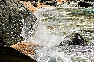 Water splashing on the rocks of the famous Shell Beach, in St. Barthâ€™s Island St. Bartâ€™s Island Caribbean