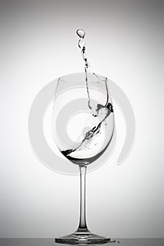 Water splashing in a wine glass