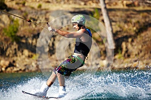 Water sports, wakeboard and surf with man in lake for training, summer break and travel vacation. Wave, adrenaline