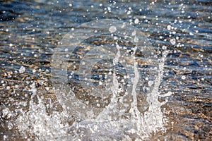 Water spray produced by wave on beachline