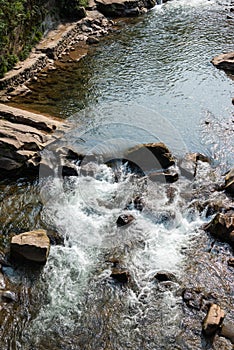 Water spring flowing in the mountain close-up view