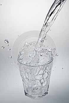 Water stream being poured into a glass