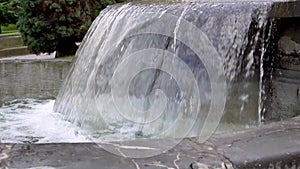 Water stream of a cascading stone fountain