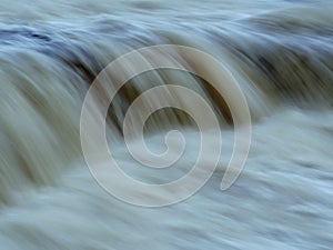 Water stream dropping over the cliff