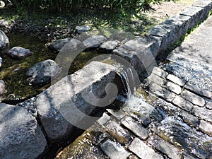 Water stream, pond  in green park  in Kotka, Finland