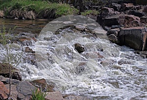 Water stream running over rocks. Cherry Creek in Denver