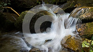 Water stream with small waterfalls in the river. Slovakia