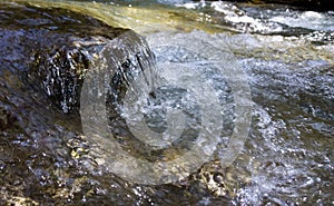 Water stream with small waterfalls in the river. Slovakia