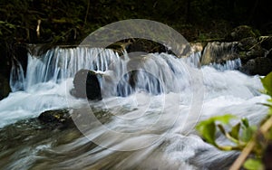 Water stream with small waterfalls in the river. Slovakia