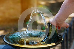 Water streaming from drinking fountain