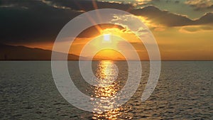 Water sunset rays at ocean time lapse