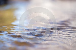 Water surface close up. Abstract background of water surface with waves.