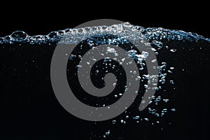 Water Surface with Ripple and Bubbles Float Up on Black Background