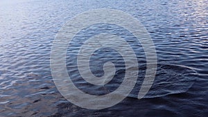 Water surface with ripples and circles on the water