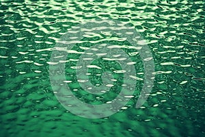 Water surface with ripples,  Green color tone,  Abstract background
