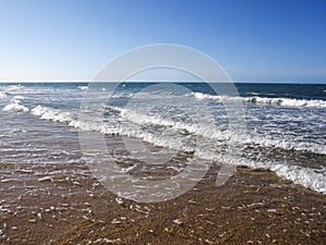 Water surface of sea or ocean with horizon and blue sky or sea w