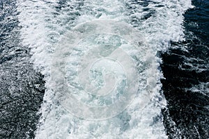 Water surface of the sea. View from ship stern with ship trace on water