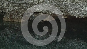 The water surface of an underground lake in an ice karst cave.