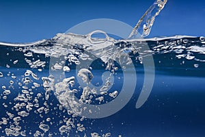 Water surface with wave and bubbles