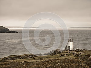 With the water of Swarbacks Minn in the background, the remote, automated, solar powered  lighthouse at Muckle Roe