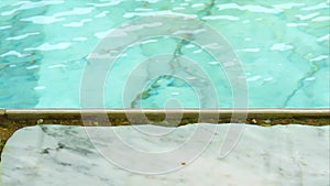 Water in the swimming pool filled with chlorine can erode marble floors